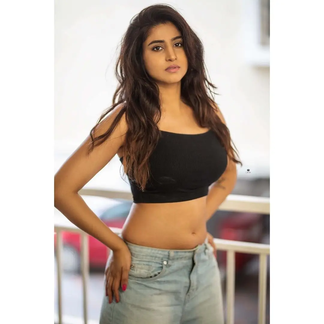 ETV Actress Varshini Sounderajan Stills in Black Top Blue Jeans